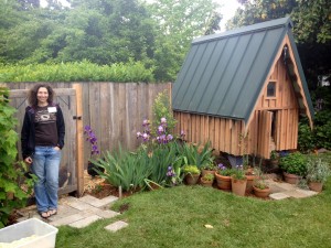 Megan Conca in front of the Redwood Tudor chicken run; photo by Mica Habarad.
